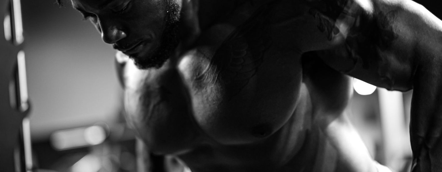 Muscular man exercising in gym, showcasing strength and focus. — Why You Need To Feed You Baby Purified Water?