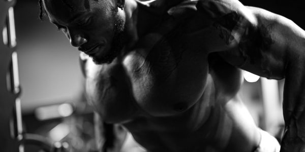 Muscular man exercising in gym, showcasing strength and focus. — Why You Need To Feed You Baby Purified Water?